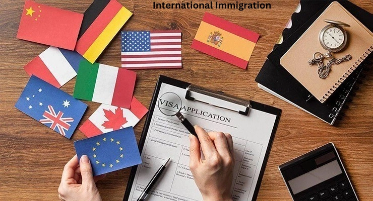 Hands holding international flags beside a visa application form, representing global immigration and residency processes.