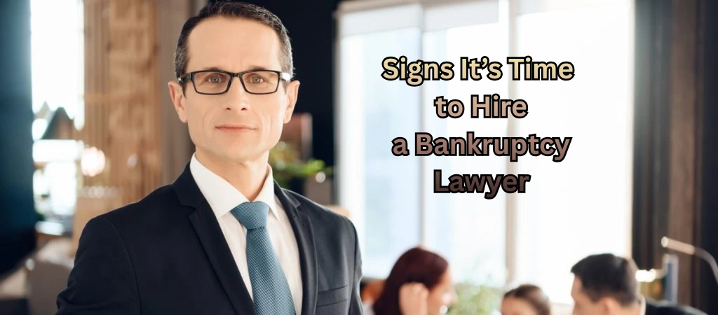 Professional bankruptcy lawyer standing confidently in an office, with colleagues discussing paperwork in the background.