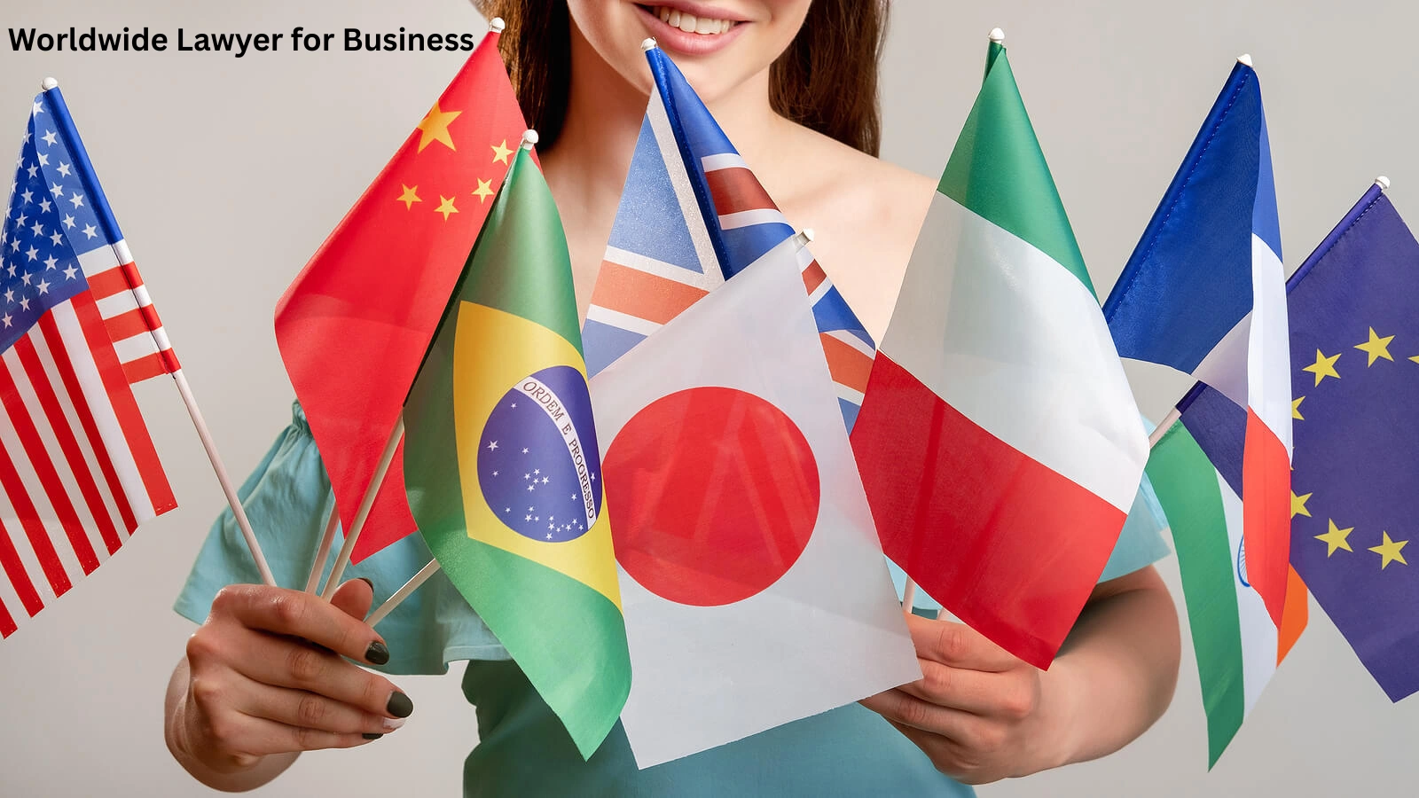 Worldwide lawyer for business and immigration law represented by a professional holding multiple international flags symbolizing global legal expertise and cross-border services.